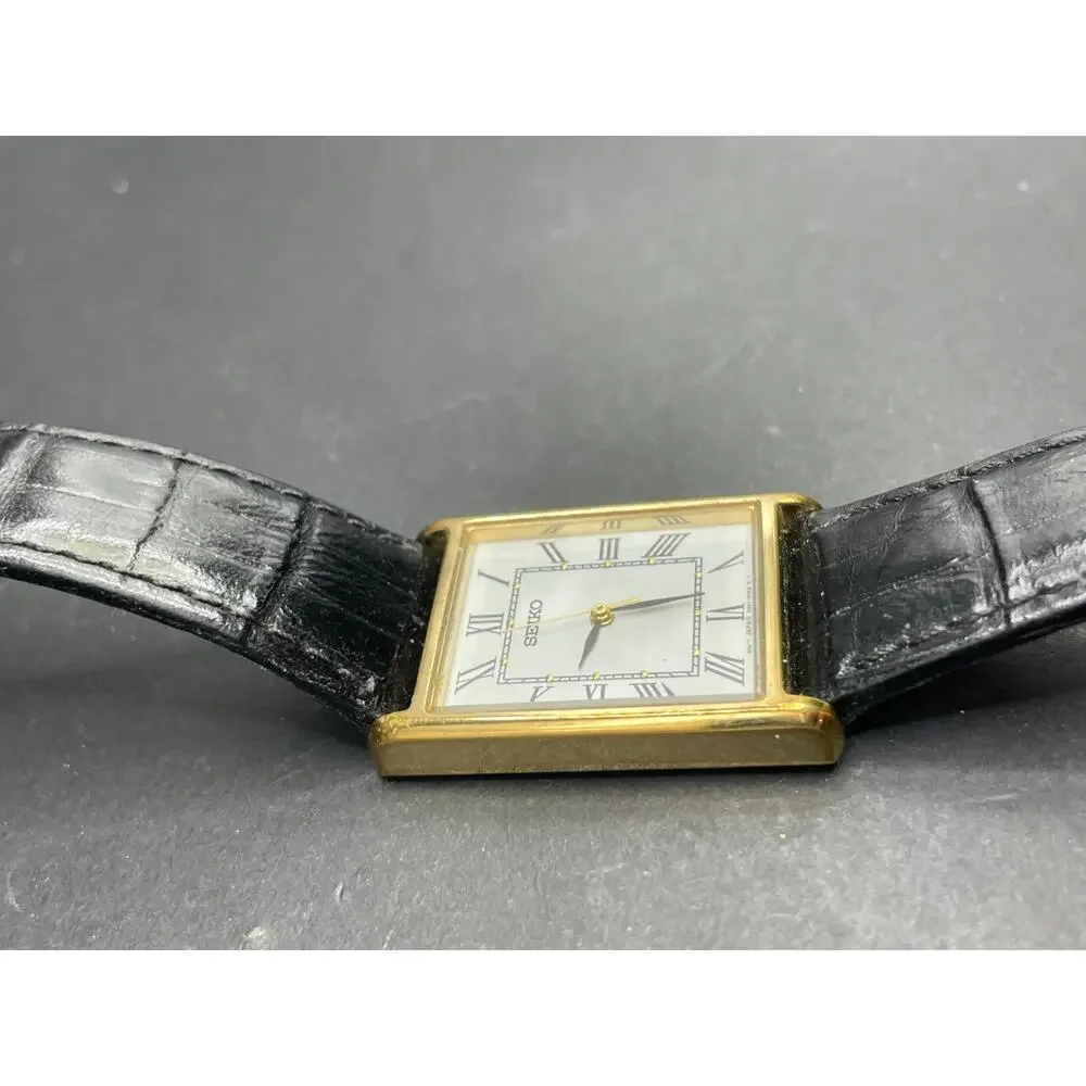 Seiko 7N01-0EZ0 Tank Rectangle Gold Tone Quartz Watch Black Leather Band 25MM
